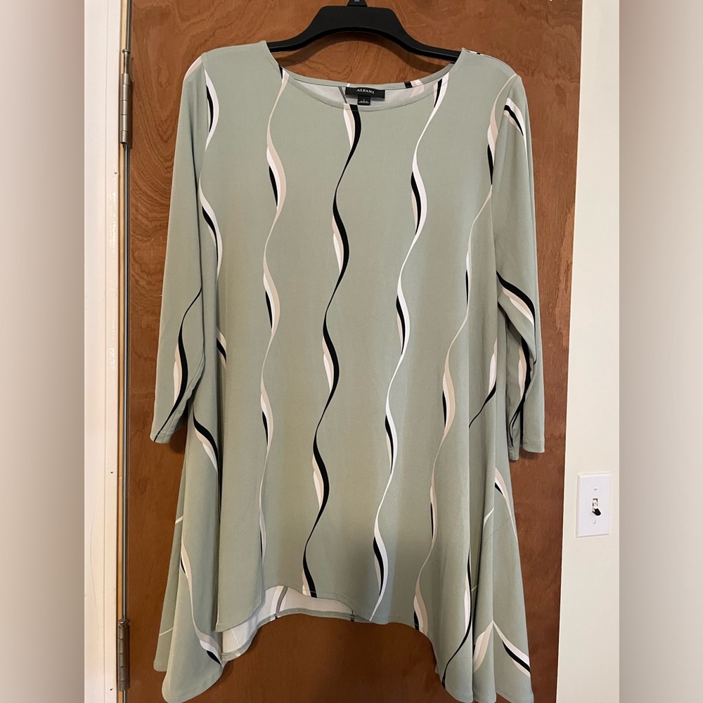 Very pretty swing dress or a long top.